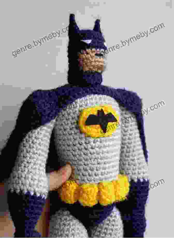 A Close Up Of The Crocheted Batman Amigurumi, Highlighting The Intricate Details Of Its Cowl, Cape, And Utility Belt. Crochet Batman Pattern