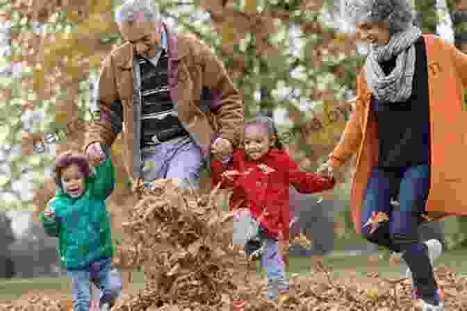 Grandparents And Grandchildren Playing And Laughing In The Park. Being A Proactive Grandfather: How To Make A Difference