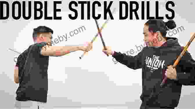 Two Filipino Stick Fighters Engaged In A Fierce Duel, Demonstrating The Deadly Techniques Of Eskrima. Filipino Stick Fighting Techniques: The Essential Techniques Of Cabales Serrada Escrima